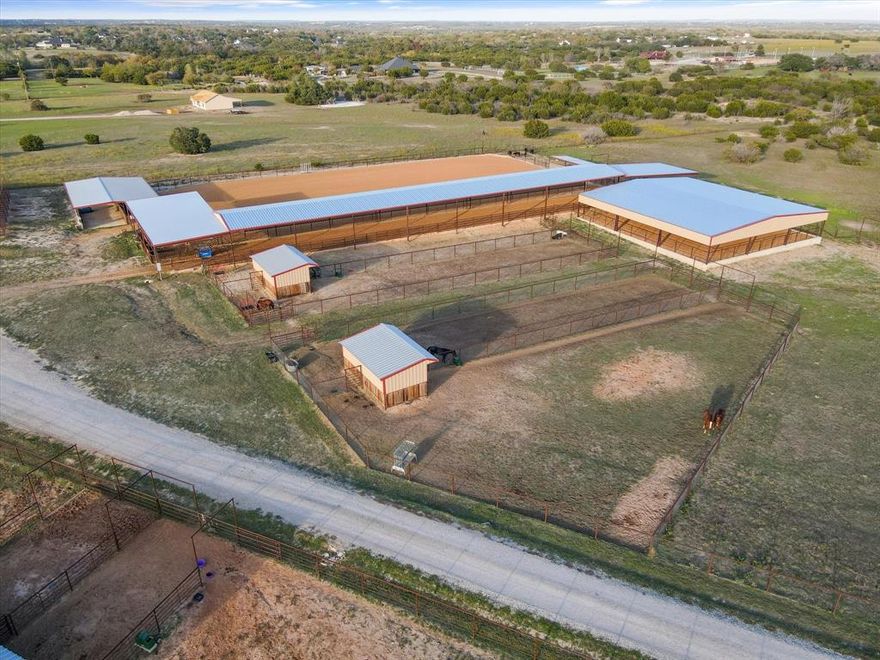 Welcome to this luxurious 4-bed, 3-bath horse property on 15 pristine acres. The main barn has 9 stalls, including 6 with runs and 3 without. 2 stalls by the arena can be cut into (4) 15x15 stalls! Not only are there several stalls, there are 9 turnouts, 4 of which have loafing sheds, all with automatic waters. Additional amenities include a wash rack with a hot water heater, a fly system, one 50-amp plug and two 30-amp plugs for additional hookups. There is a hay barn for year round storage, keeping feed in mint condition. The tack room has a mini split AC unit, ensuring a temperature controlled space for storing all your tack & saddles. This property also has an outdoor team roping arena which is 130x250ft, and a covered calf lane that is 230x35ft. Both the team roping arena and calf lane have covered boxes! Last but not least there is a covered arena 80x80ft that can be a holding pen for calves or a covered area for a horse walker.