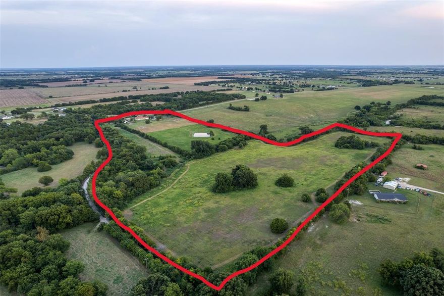 32 beautiful acres with no deed restrictions. There is separate fencing perfect for horses or livestock! This property features a comfortable 2-bedroom home with a spacious living area ideal for gatherings, plus a great kitchen with an island sink and large pantry and natural wood cabinets. Recent updates include a new septic system, tankless water heater, updated AC.  A large barn with partial concrete flooring offers endless possibilities for storage, equipment, or animals. With three ponds there's plenty of space to spread out. This land would be perfect for adding another home or creating your dream ranch or commercial setup! Additional MLS 21036678 comes with property.