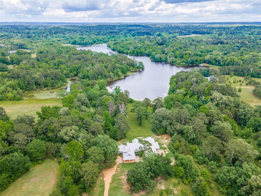 Set lakeside in the gated 2,177-acre retreat of Cross Pines Ranch – just 90 minutes from Dallas – this custom-built ranch-style residence presents 3 spacious bedrooms and 3 baths across 3,064 sq ft, surrounded by 5.02 serene acres. Designed by Gary Covert, AIA, the home blends refined simplicity with effortless countryside charm.
Walls of windows bring the lake’s calm edge into the living spaces, where a stone-clad fireplace anchors the open floor plan and invites relaxed gatherings. The kitchen is crafted for comfort and ease—natural stone counters, kitchen island, built-in pantry, and a seamless transition to the porch and yard make daily life and entertaining equally welcoming.
Outside, the home embraces its setting with a covered porch overlooking the lake and expansive yard, mature trees, and the peaceful rhythm of nature. The 5-acre homesite offers rare privacy while granting full access to Cross Pines Ranch amenities: equestrian center with ranch horses, stocked fishing lakes, trail riding, a private clubhouse and pool, and full-time ranch staff maintaining the property and experience.
For those who seek a true ranch lifestyle with elegant yet approachable living, this offering delivers both refuge and refinement in a community built for those who want life to move at their pace.