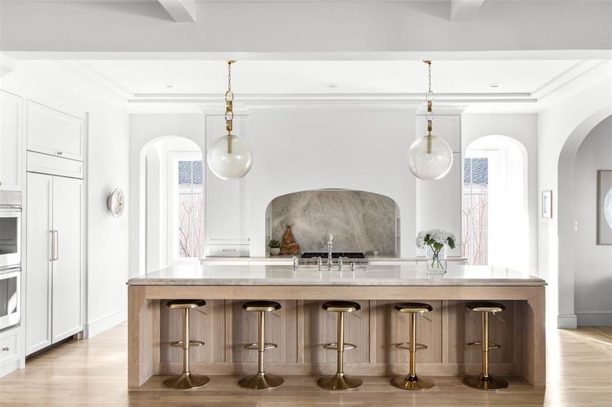 Designed and built by Jessica Koltun Home, this striking Midway Hollow residence is a sophisticated transitional home offering 5 bedrooms and 5 bathrooms, thoughtfully composed to balance modern elegance with everyday functionality. Bright, open interiors are anchored by clean architectural lines, generous ceiling heights, and carefully curated finishes—including designer light fixtures and plumbing—that create a cohesive, warm aesthetic throughout.

Expansive living areas flow effortlessly into a chef’s kitchen defined by premium materials, custom cabinetry, and an oversized island ideal for entertaining and daily life. A guest bedroom is conveniently located downstairs, while private bedroom suites throughout the home provide comfort and privacy, including a serene primary retreat designed for rest and relaxation.

Upstairs, a spacious game room and an additional flex room offer versatility for work, fitness, or media. The large backyard is thoughtfully designed with turf and concrete pavers, creating a low-maintenance outdoor space with an additional seating area perfect for gathering and entertaining.

Architectural detail, elevated craftsmanship, and high-end fixtures and finishes are evident at every turn, while the seamless indoor-outdoor connection enhances everyday livability. Ideally located in one of Dallas’s most desirable neighborhoods, this residence reflects timeless design, quality construction, and a true sense of luxury.