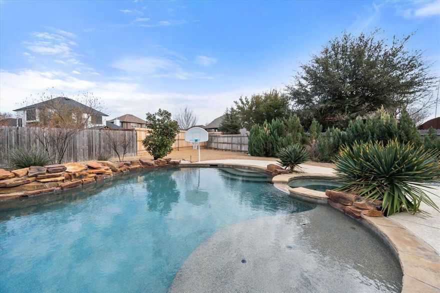 Seller is offering a $10,000 concession for the buyer to use in the way that works best for them, including closing costs, interest rate buy-down, or other allowable buyer expenses.
925 Sandy Hill in Burleson, where thoughtful design, functional space, and inviting outdoor living come together beautifully. Plantation shutters throughout add timeless style and natural light control, while custom lighting enhances the dining and living areas. The kitchen is equipped with Café stainless steel appliances, a gas cooktop with pot filler, movable island, and butler’s pantry offering additional prep and storage space.

The primary suite features a spacious wet-room style shower designed for comfort and convenience. Upstairs offers four bedrooms along with two separate living areas, creating flexible options for work, play, or relaxation. Storage space is abundant throughout the home.

Step outside to enjoy the backyard retreat featuring an in-ground pool and spa, outdoor fireplace, additional concrete parking, and a gas grill. A removable security pool fence adds flexibility for outdoor enjoyment.

This home offers a combination of comfort, functionality, and entertaining space ready for its next owner to enjoy.