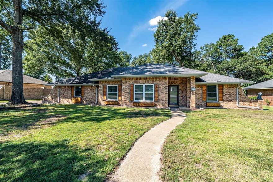 This charming 3-bedroom, 2-bath home offers extensive updates throughout and sits on just under a half-acre in Tyler ISD. The spacious living area welcomes you with vaulted ceilings, a cozy fireplace, and built-ins, while the remodeled kitchen features a new stainless steel stove and dishwasher, updated countertops, backsplash, paint, and hardware. Additional living and dining areas provide a versatile flex space—perfect for a home office. The primary suite includes a beautifully remodeled ensuite bath, while two guest rooms share an updated full hall bath. A bright sunroom extends the living space, overlooking the backyard with a storage building. Recent updates include fresh paint throughout, removal of popcorn ceilings, luxury vinyl plank flooring, new windows, lighting, planter boxes, and window seat benches with storage. More updates include outdoor shutters, new sink faucets throughout, water regulator, dual flush toilets, updated shower heads in both baths, a new chimney cap, and a belt-driven garage motor with springs—with even more upgrades detailed in Associated Documents. Conveniently located just 4.8 miles south of The Village at Cumberland Park, this home blends style, comfort, and functionality inside andout. Come See! Come Buy!