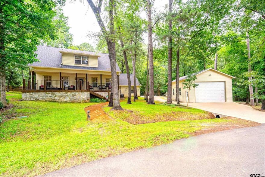 Located in the sought-after Tall Tree subdivision just across the street from Lake Cypress Springs, this beautifully maintained 3-bedroom, 2.5-bath waterview home offers space with access to premier amenities including a pool, tennis courts, clubhouse, and boat ramp. Inside, an open-concept design showcases warm wood flooring and a well-appointed kitchen with granite countertops, custom cabinetry, stainless steel appliances, and an island for gathering. The main-level primary suite offers a spa-like bath with soaking tub, walk-in shower, dual vanities, and spacious walk-in closets. Outdoor living is just as inviting with a covered front porch, covered back porch, and fire pit area surrounded by mature trees. A detached 25x35 shop-garage and concrete drive provide ample space for vehicles and lake toys. A propane-fueled Generac generator adds comfort and peace of mind.