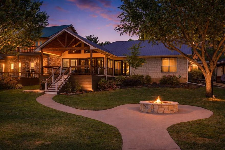 Escape the hustle and bustle of city life and retreat to your stunning 70 ft. waterfront sanctuary on Cedar Creek Lake, located just one hour from Downtown Dallas. Completely rebuilt from the slab up in 2001, this breathtaking, open water single-story home blends modern design, comfort, and effortless lakeside living. Sweeping luxury vinyl plank floors guide you into a light-filled, open-concept living space where a dramatic wall of windows frames picturesque lake views and fills the home with natural light. The thoughtfully designed layout offers seamless sightlines between the living room, kitchen, and dining area. Unwind in the inviting living room highlighted by soaring vaulted ceilings and tranquil waterfront vistas. The beautifully appointed kitchen features granite counter-tops, Whirlpool stainless steel appliances, and soft-close shaker-style cabinetry. The spacious dining area easily accommodates both casual gatherings and elegant dinner parties. Both bathrooms have been tastefully renovated with modern vanities and contemporary finishes, creating stylish and comfortable retreats. Step outside to experience the true magic of lake life. Your private outdoor living space is designed for relaxation and entertaining, featuring a cedar-beamed vaulted covered patio, cozy firepit, and breathtaking water views. The impressive two-story dock includes a boat slip with cradle, two Sea-Doo lifts, and durable low-maintenance Trex decking and stairs, making lake days effortless. Life on Cedar Creek Lake offers endless recreation—from boating, wakeboarding, and fishing to exploring nearby wineries, breweries, waterfront dining, and both private and public lakefront country clubs. Residents also enjoy beloved local events like the annual Thunder Over Cedar Creek Lake Airshow, making this an exceptional destination for both relaxation and adventure. This is more than a home—it’s the ultimate lakeside lifestyle.