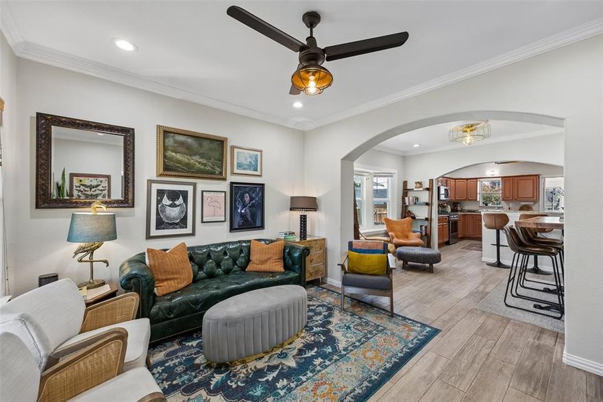 Fully reimagined in 2019, this North Oak Cliff Craftsman blends timeless character with modern charm. From the inviting covered front porch to the open, light-filled interior, every detail feels intentional. Wood-look tile floors anchor expansive living spaces, while the kitchen makes a statement w-granite counters, terra cotta cabinetry, designer SMEG refrigerator, & abundant storage—perfect for both daily living & entertaining. Generous laundry room off the kitchen fits full size W&D and a 2nd refrigerator. The thoughtfully redesigned bath offers an elevated feel w-designer tile & classic clawfoot tub. All three bedrooms are generously sized with large closets & great natural light. Step outside to a spacious backyard framed by mature trees, complete with a beautiful wood deck & storage shed—ideal for relaxing or hosting. Positioned on a quiet curve of a dead-end street, this home offers rare tranquility just moments from Kidd Springs Park, the Aquatic Center, and the energy of Bishop Arts—where dining, shopping, and culture come together. A true Oak Cliff gem, ready for its next chapter.