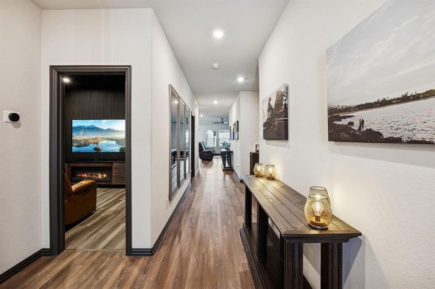 Welcome to 2128 Gill Star Drive, a 2021-built, move-in ready home offering 4 bedrooms, 3 bathrooms, and approximately 2,011 square feet of modern living in a highly convenient location. Designed for today's lifestyle, this open-concept floor plan seamlessly connects the kitchen, dining, and living areas, creating an ideal space for entertaining or everyday comfort. The upgraded kitchen features a custom finished island, updated cabinet colors, and stylish finishes that appeal to buyers searching for contemporary design and functional gathering space. The living room is media-ready with a dramatic custom accent wall designed to accommodate a 98-inch television that conveys with the home, while in-wall and ceiling speakers deliver an immersive Sonos sound experience. Hardwood flooring enhances the front rooms, offering flexible use as a home office, guest bedroom, or media room. Updated trim, lighting, and cohesive interior colors create a clean, unified aesthetic that feels both current and timeless. Energy-efficient construction supports lower utility costs and long-term value, while added gutters, exterior lighting, and uplighting elevate curb appeal. Outdoor living is expanded by an extended covered patio, perfect for relaxing or hosting gatherings. The upgraded garage includes an epoxy-coated floor, painted interior, enhanced lighting, and a mini-split HVAC system, providing a climate-controlled space ideal for hobbies, a home gym, or workshop use. The laundry room features a custom storage system designed for maximum organization. Located near major commuter routes, shopping, dining, and daily conveniences, including a Kroger just minutes away, this home offers the blend of newer construction, smart upgrades, and accessibility that buyers frequently seek. Sidewalk access enhances the home's connected neighborhood setting.