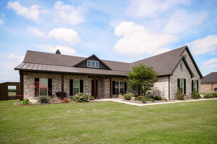 Stunning modern farmhouse just outside Waxahachie city limits on a fully fenced 1 acre lot. Home is only 5 years young and perfeclty designed for effortless indoor and outdoor living. Gorgeous curb appeal welcomes inside as you step on hand scrapped wood floors to see 4 bedrooms, 2.5 baths and a dedicated office. The vaulted living room soars with exposed wood beams, flowing into a chef ready kitchen with cabinets to the ceiling and a massive 9.5x4.5 island perfect for entertaining. Primary and secondary living spaces are spacious and bright. Brand new hail impact shingle roof, designed to reduce future storm damage and decrease insurance costs for the new owner. Step outside to a covered 12x43 patio overlooking a dramatic Texas sky with no neighbors behind for picture-perfect sunsets. Entertain or unwind at the luxury style 40x20 pool and basketball court. Property also includes a 3 car garage and huge yard for pets, play, or future additions. A rare combination of modern finishes, acreage, and resort-style backyard living just minutes from downtown Waxahachie.