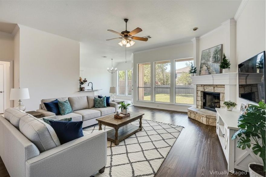 Welcome to this updated 3-bedroom, 2-bath single-family home with a 2-car garage, located on a peaceful street in a mature neighborhood. The open floor plan features soaring vaulted ceilings and a cozy stone fireplace that anchors the living area. The kitchen has been refreshed for everyday cooking and entertaining. The spacious primary suite includes a soaking tub, separate shower and double vanity for a true retreat. All secondary bedrooms offer walk-in closets, perfect for storage, guests or a home office. Step outside to a covered patio overlooking a generous yard secured by a 6-foot privacy fence. Ideal for outdoor living, pets, and low-maintenance landscaping. 
Back on the market due to no fault of the seller.