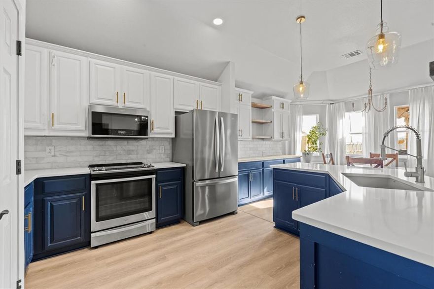 Spacious home with flexible living spaces! Welcome to this beautifully updated home offering plenty of room to spread out and enjoy! Featuring four bedrooms plus a versatile flex space, perfect for a home office, playroom, or hobby area, this layout adapts effortlessly to your lifestyle. The expansive living area is warm and inviting with a charming wood-burning fireplace and flows seamlessly into the dining area and kitchen—ideal for both everyday living and entertaining. The kitchen shines with painted cabinets, new quartzite countertops, a marble backsplash, upgraded sink and faucet, and a thoughtfully added coffee bar with extra cabinetry and butcher block countertop. Newer stainless appliances include an upgraded refrigerator, dishwasher, and convection microwave. The primary suite is truly oversized, offering enough space for a sitting area or private office. It now features a second closet for added storage and a spa-like bath with dual sinks, a garden tub, and separate shower, enhanced by upgraded tile flooring. Throughout the home, enjoy the fresh look of all-new luxury vinyl plank flooring, updated lighting in the living and dining areas, and stylish new pendant lighting in the kitchen. A striking cedar plank ceiling beam adds character and architectural interest between the living room and kitchen. Step outside to a large concrete patio with covered area, perfect for relaxing or entertaining, all surrounded by a wood privacy fence. Located in a quiet neighborhood, this move-in ready home blends comfort, style, and thoughtful upgrades throughout.