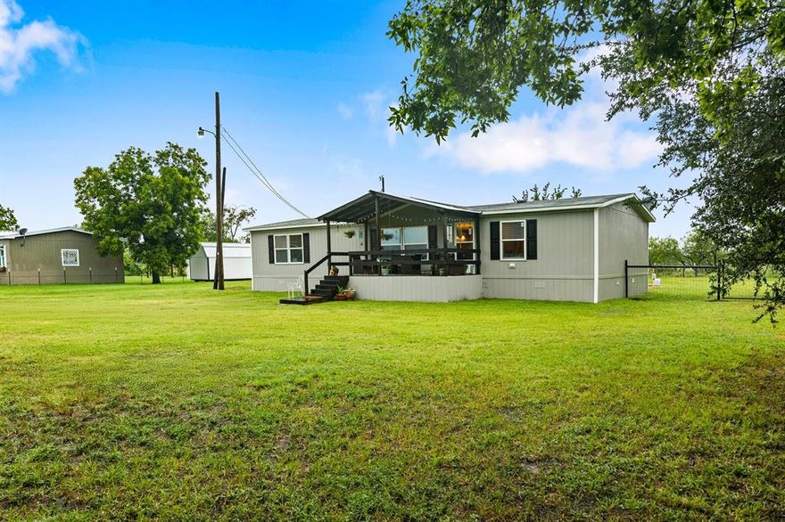 Charming 3-bedroom, 2-bath manufactured home on 0.6 acres in a peaceful country setting—just 30 minutes from Waco! This well-kept home features an open-concept layout, updated flooring, and new appliances in a spacious kitchen with a center island and abundant cabinet space. The separate laundry area adds functionality and convenience.

Relax on the covered front porch overlooking the expansive yard—ideal for entertaining, gardening, or simply enjoying the quiet of rural living. With plenty of space for parking and outdoor additions, this property provides flexibility and comfort at an affordable price.

Property Highlights:
  *   3 Bedrooms, 2 Bathrooms
  *   0.6 Acre Lot
  *   Open Floor Plan
  *   Covered Front Porch
  *   Updated Flooring
  *   New Appliances
  *   Tri-County water supply
  *   Country Setting
  *   30 Minutes from Waco

Move-in ready and perfectly suited for anyone seeking peace and privacy with easy access to the city. Schedule your private showing today!