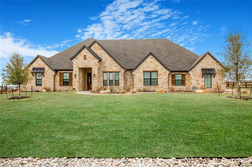 Custom LUXURY HOME built by JB REI! Crafted with love and attention to detail, this stunning 4BR, 3.5 Bath, 5 Car Garage is a masterpiece on 1 Acre of land! This gourmet kitchen dazzles with double island quartzite counters and the prep-pantry lends ample space for appliances with built-in storage. Unwind in the lavish primary suite with exquisite finishes, offering separate vanities, garden tub, and EXPANSIVE walk-in-shower. Media room includes a projector, theater lighting, and surround sound system. Two Car detached shop features: electricity, water, loft, AC, designated area for lawn mower equipment, and built-in cabinetry. Dive into your very own custom heated pool with elevated water features! Entertain guests outdoors in your deluxe exterior kitchen equipped with both Weber and Santa Maria Grills. Located in the esteemed NORTHWEST ISD, just a hop away from shopping, dining, and entertainment.