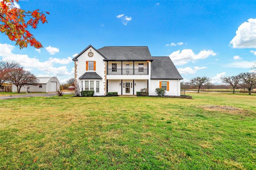 Incredible property on just under 9 acres with no city taxes. The open space and quiet of the country yet a very short drive to restaurants, grocery stores and shops and 8 miles to I35. Nicely situated home set back 80 yards from the street. Relax while fishing in your pond and taking in the beauty of the land that includes many mature Oak and Pecan trees.   The four bedroom home includes a master suite that is split from the other bedrooms and has a dual sink vanity, soaking tub, separate shower and walk in closet.  Other features include 20 ft. ceilings in the living room, a bonus room that would make an ideal office or craft space, and plenty of storage. The backyard has a nice wood deck and there is a work shop just off the house that has electricity and plumbing.