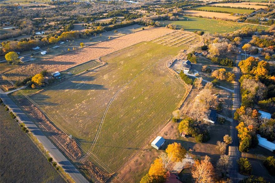 Investment Opportunity with Future Development Potential This stunning 17 acre property offers an incredible investment opportunity, perfect for future development or as a prime homesite. Accessed by County Road on two sides, this land provides the convenience of country living while being just minutes away from major highways, including Hwy 121 and the US 75 corridor. The location offers easy access to the nearby cities of Greenville, McKinney, Anna, Melissa, and Princeton. The property utilities include electric, water, and sewer. Current exemptions provide reduced taxes. With a lovely pecan tree grove adding natural beauty and charm, the land is both functional and scenic. At the front of this property sits a 1,964 sq ft ranch home and a 1,400 sq ft detached garage for extra storage or workshop space. The property is not in a floodplain, which adds to its usability. Located less than 30 minutes from Lake Lavon, this property offers the ideal balance of country tranquility and convenient access to nearby amenities. Whether you're seeking a peaceful retreat or planning for future development, this property is a must-see!