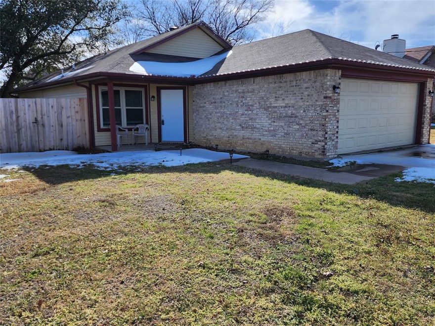 This 3 bedroom home has been updated and sits on an oversized lot with large backyard, great location close to shopping, restaurants, both Universities, and downtown Denton, walking distance to elementary school and city park, spacious open living area with vaulted beamed ceiling and brick wood burning fireplace that opens to breakfast room that flows into kitchen with breakfast bar, stainless steel appliances, smooth top range, built in microwave, bar like sliding door to walk-in pantry, large primary bedroom with double closets and ceiling fan, easy to maintain hard surface floors throughtout the house, ceiling fans in all bedrooms, both baths have updated vanities and over-the-john cabinets, covered front porch and covered patio, 2 car garage with garage door opener, gutters, wood fence with gates on both sides of the house, there is a current lease in place that expires June 30, 2026