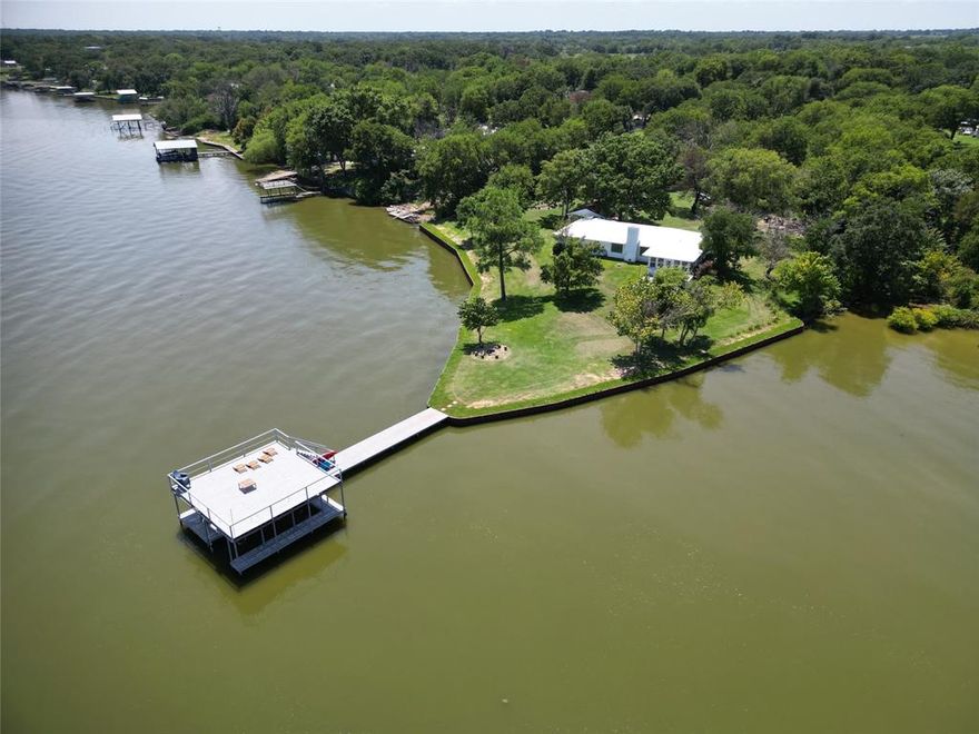Views, views and more views! This lot is a peninsula surrounded by open water. You are buying one of the best views in Cedar Creek Lake with the ultimate privacy and serenity, fully furnished, and a big dock that includes a party deck. House was completely remodeled in 2023 with new sprinkler system, gutters, AC and a new lake wall; roof and windows (2022 and 2023). Dock was re done in 2024 as well as back deck. Back screened porched was enclosed, remodeled and added AC to make it part of the house. Just an hour from Dallas, this is the perfect escape for the weekend or a full time residence with such amazing views, you will want to work from home! Foundation Engineer's report available. SHORT TERM RENTAL ALLOWED.
