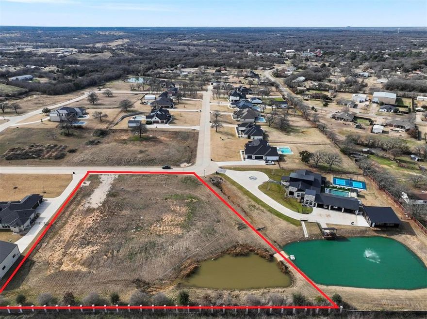 Amazing opportunity to own 2.081 acres in prestigious gated community of Veridian Point in Burleson. Beautiful homesite with pond right on the corner. this neighborhood boasts beautiful lots with executive style custom homes and a gate for privacy. Build your beautiful home in Veridian Point!!
