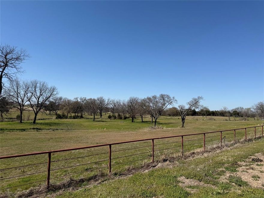 Rare acreage with complete road frontage on Bus Hwy 377, just outside the Whitesboro city limits.  Gorgeous mature pecan trees and creek run through this 7 acre tract, part of an existing 18 acre tract.  This beautiful property would be a dream site for a new home or investment opportunity.   Bring your own builder and enjoy country life!  A portion of the property is in flood zone due to creek.