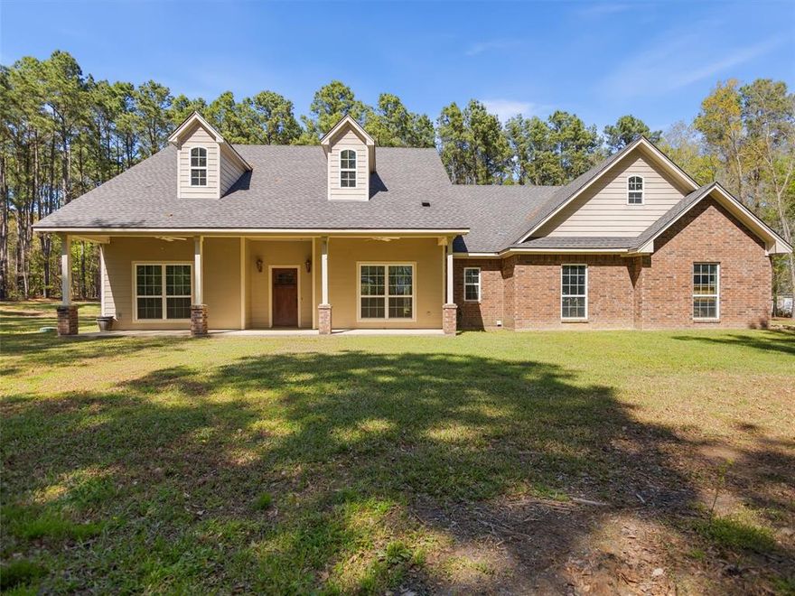 Here is the picture perfect home you’ve been looking for! Located on 5 acres of pristine land surrounded by mature trees that offer the most privacy. This home is located in Harmony ISD and is only 13 minutes from the heart of Gilmer. As you enter you are greeted with high ceilings, lots of natural light and an open concept living space that has just the right set up. On one end of the home you’ll find the two guest rooms, one has an oversized closet. The two rooms are connected by a Jack and Jill bathroom with one half that acts as a powder bath for guests. As you flow back across the living space you’ll find the laundry room, the oversized garage that can fit most trucks and a hallway that leads to the primary suite. There you will find a spacious bedroom with a door that leads to the patio. The en-suite bath is also sizeable and offers a tiled walk in shower, a soaking tub, separate vanities and a spacious walk in closet. From there you can head out back to find a vast amount of covered patio space which is ideal for relaxing or entertaining. There is also a fire pit area right off the patio. This home checks all the boxes and just might be exactly what you’ve been looking for. Come take a look and see