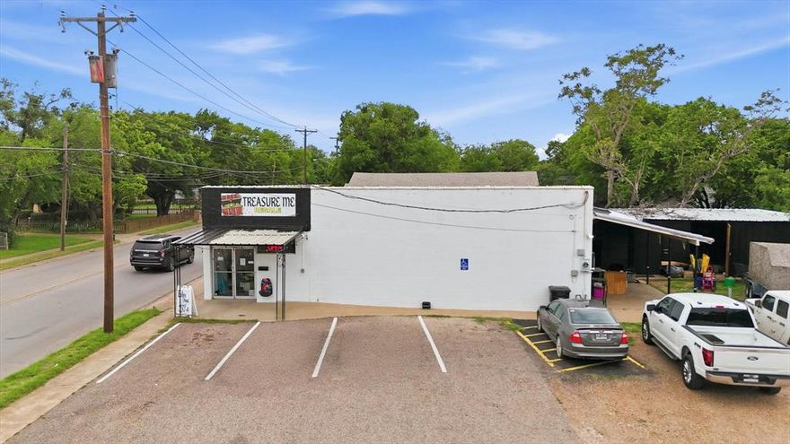 Positioned on a high-visibility corner lot along a heavily trafficked roadway, this property offers outstanding exposure and accessibility for your business. The site features a generous parking area, providing convenience for both customers and employees. The building’s interior boasts an open, adaptable layout, allowing for a wide range of configurations to suit your operational needs. It is particularly well-suited for service-based businesses such as plumbing, electrical, or similar trades. Additional amenities include a dedicated breakroom and two half bathrooms, enhancing functionality for staff. Further adding to its value are two on-site storage buildings, ideal for housing equipment, materials, or inventory. Zoned Regional Commercial District, this property presents a prime opportunity to establish or expand your business in a strategic, high-exposure location.