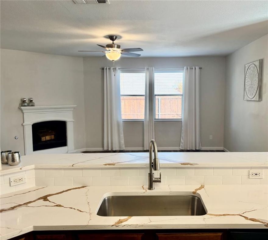 Welcome to this beautifully updated, well-maintained south-facing home in highly sought-after Prosper ISD, with wonderful community amenities and no MUD or PID. Ideally located less than a mile from Hwy 380, Baylor Hospital, the fire department, Kroger, and more, convenience is unmatched.
The open floor plan uses every inch wisely, featuring an entry closet, a hallway linen closet converted into a media hub, and a spacious walk-in utility room. The kitchen offers a walk-in pantry, new countertops and backsplash, stainless steel appliances with a gas range, and generous cabinetry.
The primary suite includes a large walk-in closet and a bath with a separate soaking tub, rain-head shower, and bidet. Additional features include framed mirrors and overhead storage in the bathrooms, a walk-in attic with built-in shelving, and a split-bedroom layout for privacy. Most of the main floor boasts 9-foot white ceilings and no carpet, with carpet only on the stairs and in the flexible upstairs game room, which can serve as a 4th bedroom or office. Major updates include: new countertops, backsplash, disposal, and stainless steel refrigerator (2025); new flooring, baseboards, and furnace (2024); water heater (2019); and upgraded plumbing fixtures, lighting, dishwasher, and microwave. The living room features a wood- or gas-burning fireplace and is pre-wired for a mounted TV. Enjoy a large private backyard with a board-on-board fence. Community amenities include a pool, park, jogging trails, a scenic pond ideal for fishing or canoeing, and a floating pier.