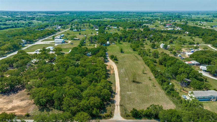Private piece of country living. Live, work, and play with no deed restrictions or city taxes! Want to run your business and be steps away from home? The impressive 30x40 shop on 8-inch slab, with electricity is situated near the front entry of the property. Multiple uses, two lateral line Septic systems, and a private well lend this property to self-containment. Bale coastal or build another family residence or business. Beautiful mature trees make gatherings a shaded pleasure. Fully fenced...Easement to the back property with a gate, on the right fence line. Proposed Privacy fence separating the acreage, first right of refusal for the back four acres upon availability.  All of this with a Decatur address. Five minutes from Hwy 287 and Hwy 380. This property is a peaceful country GEM!
Value is in the land and shop, house sold as is.
Owner Financing Available.