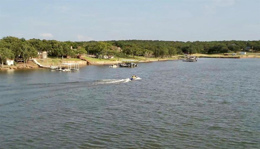 Welcome to Nocona Hills! Only a short 1.5 hour drive from Frisco and the DFW Metroplex, this 1,300 acre North Central Texas rural residential gated community on Lake Nocona in Montague County Texas is a quiet, Beautiful undiscovered gem that must be seen in person to fully appreciate. Much of this prime waterfront development on Lake Nocona is now available as the seller is offering an incredible 158 individually deeded and platted .25 acre residential lots, Some lots are larger up to .50 all complete with electricity, water and high-speed internet service. Being offered at only $10,000 per residential lot, this listing presents an incredible opportunity for an investor, residential home builder or a 1031 exchange buyer looking to park their capital in a once in a lifetime opportunity. Nocona Hills is a residential gated community with a private community boat ramp on Lake Nocona, an 18-hole private golf course and an exceptional 3000’ grass over asphalt airpark landing strip. The roads and the 24 hour manned gate are maintained and provided by the Nocona Hills Homeowner's Association. All 158 lots are platted and deeded with public water provided by the Nocona Hills Water Supply Corp with electrical service conveniently supplied by PenTex Energy. This property is a dream for developers or builders seeking to create a signature project without the upfront cost of water, electricity and utility infrastructure. Nocona Hills offers an unparalleled lifestyle perfect for families, retirees, and vacationers alike. Exciting News, Club house and pool are under remodel so fun for the community. Developer Builder Investment Special! Beautiful Golf course lots over looking the well maintained golf course. There are a variety of nice lots that have lake gorgeous views. Two private lakes (one listed as top 5 Bass fishing Texas) a community boat ramp and dock ready to put your boats out on the water and enjoy the Lake life. Lots have mature trees great shade space to enjoy.