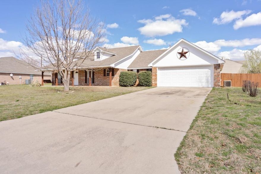 Move in ready! Located in the highly sought after Whispering Winds Estates, this beautifully refreshed 3-bedroom, 2-bath home offers comfort and  charm! Welcome to 107 Ashley Street, a spacious home built in 2003 featuring 1,890 sq ft on a generous 0.31-acre lot. The inviting curb appeal begins with a large front yard and an extended covered front porch complete with a charming porch swing—perfect for relaxing and enjoying peaceful evenings.  Inside, the home has been thoughtfully updated with luxury vinyl plank flooring, fresh interior paint, updated lighting, new faucets and fixtures, new toilets, a new garbage disposal, new dishwasher, new range stove and new microwave. $30,000 in recent upgrades.  The cozy wood-burning fireplace creates a warm focal point in the living area, making the space ideal for both everyday living and entertaining.
The attached 2-car garage includes a dedicated workshop area, perfect for hobbies, projects, or additional storage. Step outside to an expansive backyard featuring a privacy fence, a 10-foot alleyway behind the property, and a lean-to for extra storage.
Exterior improvements include new siding, fresh paint, pressure washing, and replaced fence panels where needed, giving the home a clean, well-maintained look. Water heater replacement (2023). 5 stage Reverse Osmosis.
Conveniently located in the heart of Alvord, the home is within walking distance to First Baptist Church and just minutes from Alvord schools, the post office, and local grocery stores. Situated in the highly sought-after Alvord ISD, this property offers the perfect combination of small-town charm, modern updates, and move-in ready living.
Don’t miss your opportunity to own this beautifully updated home! All information deemed reliable but not guaranteed. Buyer and buyer’s agent to verify all information including square footage, taxes, easements, restrictions, schools, and other pertinent details.