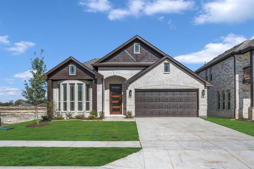 NEW! NEVER LIVED IN. Available to Move-In! The Cypress, our most popular single-story home, is designed to impress with 4 spacious bedrooms and 2 bathrooms. This open layout effortlessly connects the Study, with its elegant dual doors, to the Kitchen and Family room, all featuring upgraded laminate wood floors in every living area, including the Study and Kitchen. The space is further elevated by a striking Tile-to-Mantel Fireplace and a beautiful bay window that fills the Family Room with natural light. The Deluxe Kitchen showcases all-electric stainless steel appliances, quartz countertops, two-tone color cabinetry, custom cabinets, a spacious island, pot and pan drawers, a wood vent hood over the cooktop, and under-cabinet lighting that adds both function and ambiance. The Primary Suite offers a generous walk-in closet for abundant storage and an ensuite bath with a soaking tub, separate shower, and dual vanities. 3 additional bedrooms share a thoughtfully designed bath, and the 8' custom wood front door makes a bold statement upon entry. Outside, the beautiful brick elevation and fully landscaped yard—with stone edging, trees, and a sprinkler system—enhance the home's curb appeal, while gutters offer added practicality. Situated on an interior lot, the home’s inviting covered patio provides the perfect outdoor retreat. Visit Anderson Crossing to learn more!