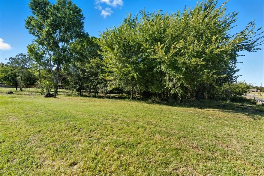 Beautiful 1-Acre Corner Lot in Springtown – Build Your Dream Home!

Welcome to this stunning 1-acre corner lot, perfectly situated in a quiet and desirable area of Springtown. Walnut creek runs along the back boundary, creating both privacy and a serene backdrop for your future home. Mature trees and gentle topography enhance the sense of seclusion This is a peaceful place to enjoy daily walks, bird watching, or simply taking in the beauty of nature right outside your door.

This lot offers the ideal setting to design and build your dream home, whether you envision a cozy retreat or a spacious modern farmhouse. With plenty of room to spread out, you’ll also have the opportunity to add outdoor living spaces, gardens, or even your own workshop.

For those seeking more land, this property is also available as part of a combined listing with the home and adjoining 1-acre lot located at 104 Candis Ct, Springtown, TX (MLS 21066093). Together, the package includes the house and a total of 2 acres, listed for $515,000. Purchasing both offers incredible flexibility – create additional outdoor amenities, build your dream shop, add RV or boat storage, or simply enjoy the extra space and privacy.

Conveniently located with easy access to schools, shopping, and major roadways, this property provides the best of both worlds – a peaceful country setting with close proximity to town.

Survey is available in Transaction Desk. Don’t miss the opportunity to secure this exceptional lot and bring your vision to life!

Disclaimer: All property information is deemed reliable but not guaranteed. Buyers, tenants, and their representatives should independently verify all details, including but not limited to measurements, permitted uses, zoning, schools, utilities, taxes and any other information important to their decision-making.