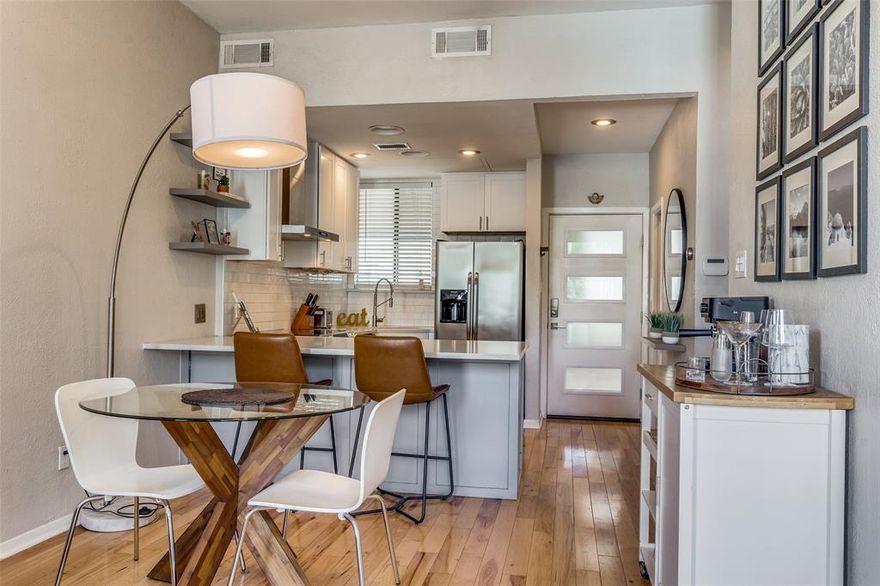 Nestled in the vibrant heart of Oak Lawn, this sophisticated two-story condo offers a premier urban lifestyle just moments from Dallas’ most celebrated high-end dining and retail. Step inside to find a light-filled, open-concept sanctuary where modern elegance meets everyday functionality. The main level boasts rich hardwood floors and a seamless flow from the inviting living area, anchored by a sleek electric fireplace, into a chef-inspired kitchen. Featuring crisp white shaker cabinetry, premium quartz countertops, a kitchen bar, and stainless-steel appliances, this space is as perfect for hosting soirées as it is for quiet morning coffees. Ascend to the second level to discover the expansive primary suite, a versatile haven with ample room for a dedicated home office or a private sitting area. Organization is effortless thanks to two generous custom closets, while stylish laminate flooring adds a contemporary touch. Smart home features, including a Ring doorbell and Nest thermostats, ensure comfort and security are always at your fingertips. Beyond your front door, the community amenities cater to both relaxation and convenience. Spend sunny afternoons lounging by the sparkling pool or enjoy quality time with your four-legged friend at the private dog run. The property also includes a shared, assigned one-car detached garage with extra storage and dedicated hookups for a stackable washer and dryer. Combining stylish finishes with an unbeatable location, this isn't just a home - it’s your gateway to the very best of Dallas living. Experience the energy of the city while enjoying the refined comfort of your own urban retreat.