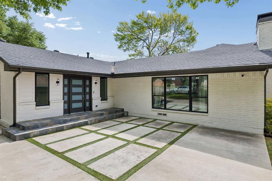 Fully remodeled home with gorgeous finishes and open concept in Richardson ISD!  Fresh paint throughout.  3 bedrooms, 3 full bathrooms, and a separate oversized bonus room with closets that could be office or 4th bedroom.  The kitchen features a large island with waterfall quartz, a coffee bar area, ample storage, and gas appliances.  The primary suite has double doors that open to the back yard, and expansive walk-in closet with built ins.  The primary bathroom has a luxurious marble shower with dual shower heads, a modern soaking tub, and dual sink vanity with tons of counter space.  Secondary bathroom has floor to ceiling glass, and an oversized shower.  The other secondary bath features wallpaper, modern tile and shower tub design.  The beautifully finished garage has a new epoxy floor, and newly painted garage door.  Step outside into a spacious backyard with newly painted covered deck, newly painted wood privacy fence, and tv outlets for outdoor entertaining.  This immaculately maintained home won't last long!