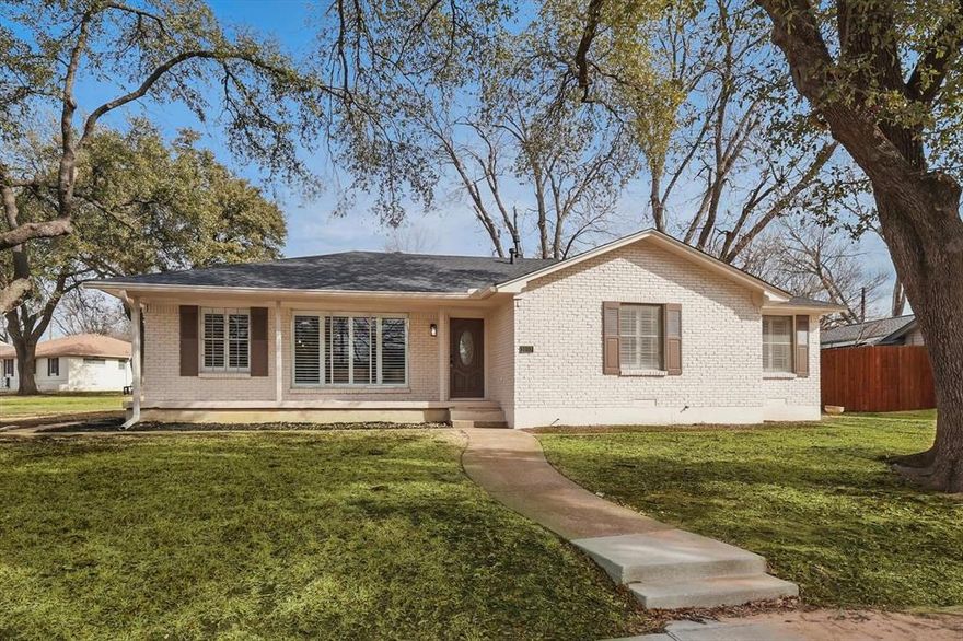 Set on a corner lot, this home has been beautifully remodeled from top to bottom. A freshly painted exterior gives it a crisp first impression, and inside you’ll find an open layout that feels bright and easy to move through. The kitchen centers around a large quartz island with seating, and the living and dining areas are grounded by a brick fireplace that adds character to the space. Just off the main area are a half bath, laundry room, and access to the two-car garage and backyard.

Down the hall, the primary suite includes two closets and an updated bathroom with double vanities and a walk-in shower. Two additional bedrooms are connected by a jack-and-jill bathroom with a shower-tub combination.

Out back, the yard is fully enclosed with a wooden privacy fence, with plenty of room for pets, play, or unwinding at the end of the day.