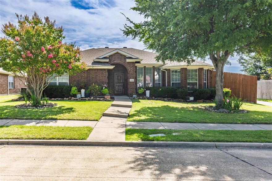 Experience refined living in this beautifully updated residence, perfectly situated on a landscaped lot with mature trees in one of Rowlett’s most desirable and established neighborhoods. From upscale interior touches to inviting outdoor spaces, this home blends luxury, comfort, and lifestyle in perfect harmony. Step inside to find a spacious living area with rich hardwood flooring, a classic wood-burning fireplace, a designer light fixture, and an upgraded ceiling fan—ideal for entertaining or unwinding in style. The heart of the home, the kitchen, is equally impressive with sleek granite countertops, a smooth electric range, built-in microwave, dishwasher and refrigerator, all premium stainless steel appliances—all just 1 to 2 years old. A stylish hanging pot rack, modern cabinet hardware, and updated lighting add custom elegance to this functional space. The breakfast nook is bathed in natural light, offering a quiet place to enjoy your mornings. The oversized primary suite provides a serene private retreat, featuring hardwood floors, and an expansive en-suite bath complete with dual vanities, a luxurious walk-in shower, a garden soaking tub, and walk-in closet. Two additional guest bedrooms offer the same hardwood flooring and share a beautifully appointed hall bath, highlighted by a custom-tiled walk-in shower with built-in seating. Outdoors, enjoy your own personal oasis with a tall privacy fence, a covered patio with a ceiling fan, and plenty of room to entertain or relax during warm Texas evenings. Enjoy all that Rowlett has to offer. Located just minutes from Lake Ray Hubbard, you’ll have easy access to boating, fishing, and lakeside dining. Commuters will appreciate easy access I-30, providing a quick drive to Dallas, or Rockwall. The home is also near scenic parks, walking trails, top-rated schools, and a variety of shopping and dining options. With its perfect blend of elegance, comfort, and location, this exceptional home is truly a rare find.