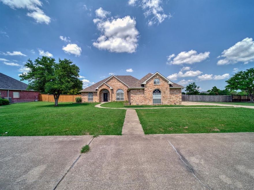 ***PRICE IMPROVEMENT***

Charming 3-Bedroom Ranch Home on 1 Acre in Gated Community – Minutes from I-20

Welcome to 1225 E. Remington Park Drive, a beautifully maintained 3-bedroom, 2-bathroom ranch-style home nestled on a spacious 1-acre lot in one of Terrell's most desirable gated communities. This inviting property offers the perfect blend of privacy, comfort, and convenience — ideal for anyone seeking peaceful country living with quick access to city amenities.

Step inside to discover a warm and open floor plan featuring a bright, airy living area with large windows that fill the space with natural light. The well-appointed kitchen boasts ample counter space, modern appliances, and a convenient breakfast bar, making it a great spot for casual meals or entertaining guests.

The primary suite offers a relaxing retreat with an en-suite bathroom, complete with a soaking tub, separate shower, and generous closet space. Two additional bedrooms provide flexibility for family, guests, or a home office setup.

Outside, the expansive backyard delivers plenty of room to roam, garden, or even add a pool or workshop. The covered patio is perfect for enjoying morning coffee or evening gatherings while taking in serene views of your private acre.

Located just minutes from Interstate 20, this home offers an easy commute to Dallas and Terrell, shopping, schools, and dining while still enjoying the peaceful charm of a gated rural neighborhood. Whether you're downsizing, starting a family, or simply craving more space — this property checks all the boxes.

Don't miss the opportunity to make this Terrell gem your own. Schedule your private tour today!