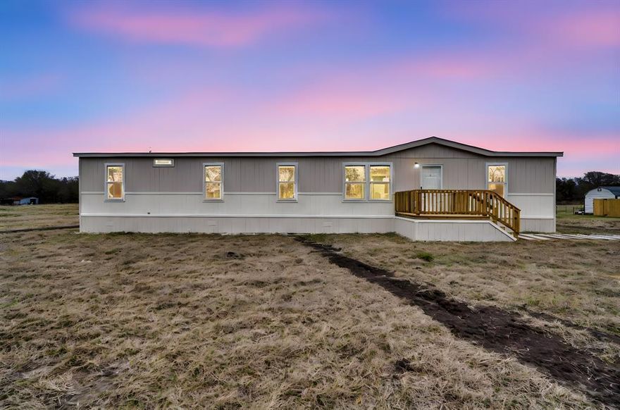 Welcome to your serene retreat on Hyde A Way! This spacious 4-bedroom, 2-bath mobile home offers the perfect blend
of comfort and tranquility, situated on a generous 1-acre lot. As you enter, you'll find an inviting open-concept living
area filled with natural light, perfect for both relaxing and entertaining. The well-appointed kitchen features modern
appliances and ample storage, making meal preparation a breeze. The master suite provides a peaceful haven with an
ensuite bath, while three additional bedrooms offer plenty of space for family or guests. Outside, enjoy the expansive
yard, ideal for gardening, outdoor activities, or simply soaking in the natural beauty surrounding you. Located just
minutes from downtown Mabank, this property offers the perfect balance of privacy and convenience. Don’t miss this
opportunity to own your own piece of paradise!