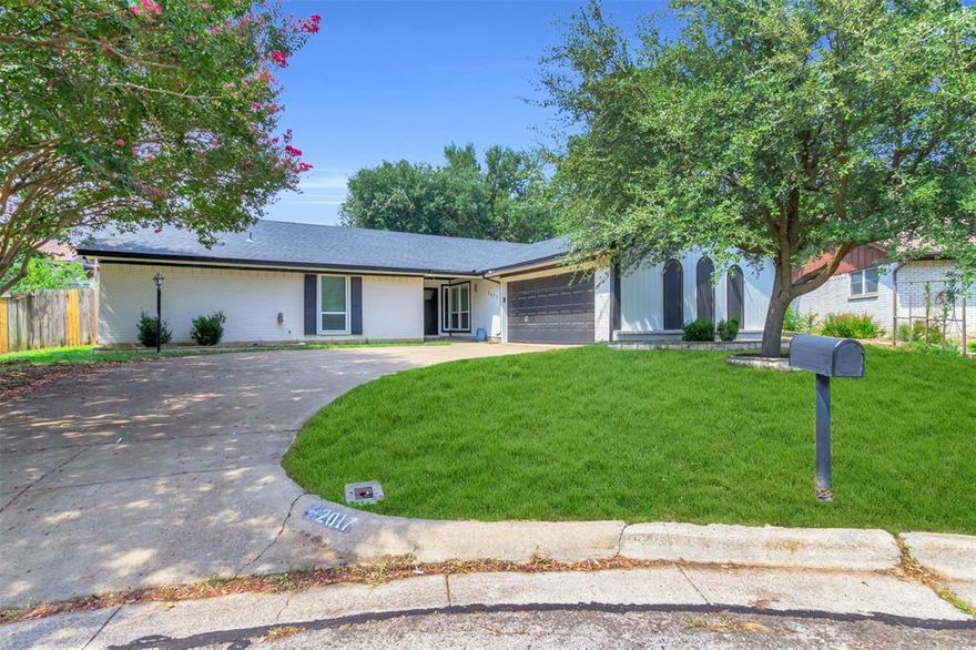 Step into this meticulously updated home, tucked away in a quiet cul-de-sac, yet just minutes from parks, top-rated schools, premier shopping, major highways, and the vibrant Texas Live! Entertainment district near both AT&T Stadium and Globe Life Field. Inside, the chef-inspired kitchen is sure to impress, showcasing custom wood cabinetry, sleek hardware, and luxurious granite countertops. The spacious, open-concept living area features soaring vaulted ceilings and a cozy brick fireplace, offering the perfect blend of warmth and elegance for both relaxing and entertaining. Whether you're hosting family gatherings or enjoying a peaceful evening at home, this inviting space effortlessly suits every occasion. With its thoughtful design, exceptional value, unbeatable location and the added fun and energy of being just steps from world-class dining, live events, and sports venues this home is a true gem in one of the most desirable neighborhoods around.