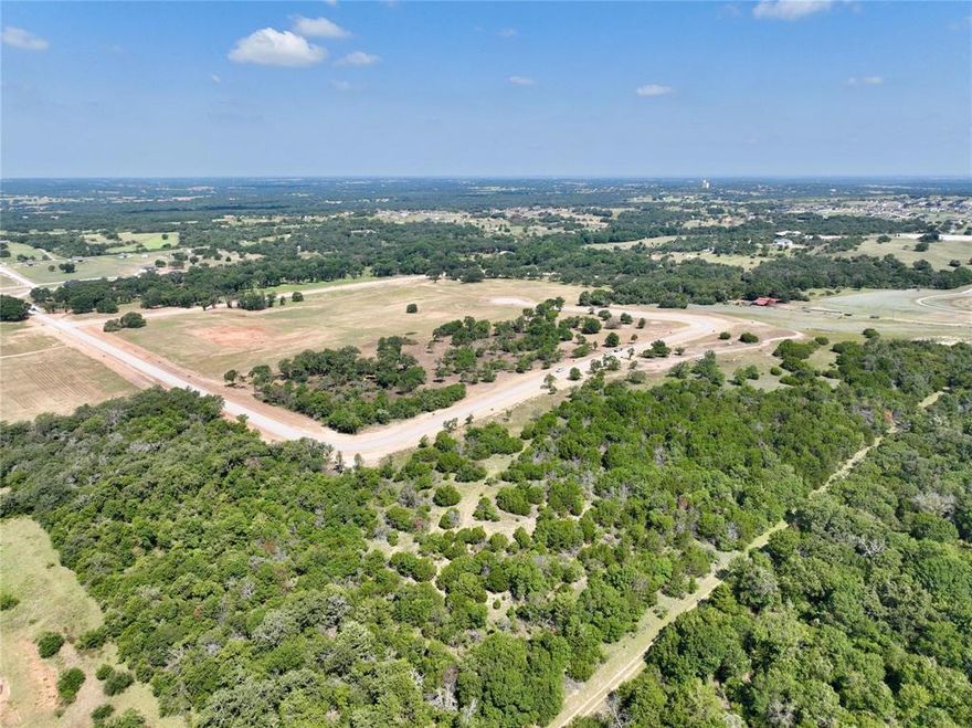 Discover the perfect blend of privacy, beauty, and convenience on this 1.954-acre homesite just minutes from Springtown and only 25 minutes to Weatherford, located within the Weatherford ISD. This rolling property offers beautiful views, partial clearing, and mature trees that create natural privacy while still giving you plenty of space to design your dream setting.
The lot is ready to build with a soils report specific to this property.  Enjoy the freedom to build your custom home with deed restrictions, no HOA, and the flexibility to bring your vision to life. One horse or cow per lot is allowed, making it ideal for small-scale country living here at The Reserve at Taylor Ranch.
Modern conveniences are already in place, including underground electricity to property, NextLink Fiber Optic, septic-ready setup, and no water bills. With rolling terrain, scenic views, and a peaceful setting, this property offers the perfect backdrop for your custom home.
Minimum home size: 1,700 sq ft.
No barndominiums.