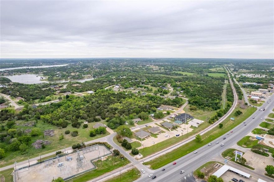 RARE OPPORTUNITY to score a SLAM DUNK development deal in the highly sought lake community of Granbury, Texas! Located just 40 minutes west of Fort Worth, this beautiful and treed acreage is nestled between a golf course on one side and Lake Granbury on the other side. The current plat map boasts 95 residential lots that average a little less than half an acre each. Additionally, the subdivision already features some established custom homes ranging in price from $400k to over $1M and all the needed utilities to develop the 95 lots are easily assessable. This land is also EXEMPT from the current Building Moratorium in Granbury. BONUS: This land sits just 3 miles from the historic Granbury town square but it is outside the City limits which minimizes any need for building permits or inspections. Don't miss out on this RARE OPPORTUNITY to score a development WIN! Please contact the listing agent for more details on this amazing project.
