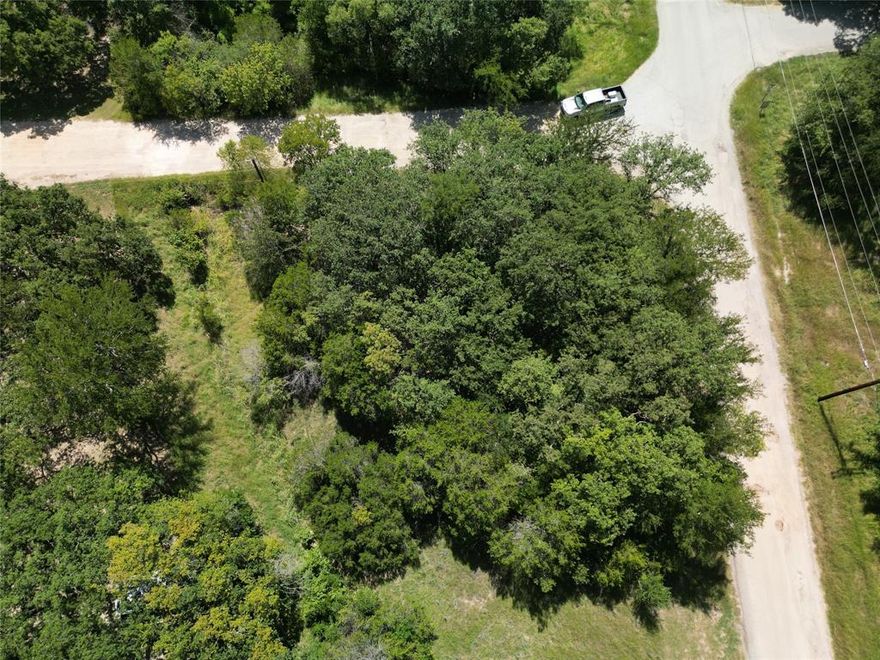 Tucked away in a peaceful, tree lined neighborhood, this lot offers a perfect setting to build your dream home or investment property. Conveniently located just minutes from Lake Granbury with easy access to shopping, dining, and the lake.