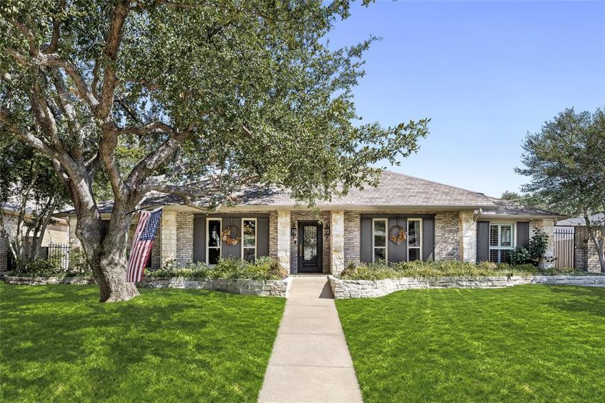 Effortlessly elegant and timeless – It’s not often a property of this caliber comes to market. Situated in the coveted Alexander’s Village neighborhood and within the highly sought-after Merriman Park Elementary attendance zone, this one-owner, one-story home has been exquisitely reimagined by a professional interior design firm. Originally built in 1979, the residence underwent a comprehensive renovation, blending classic architecture with refined, modern updates. Inside, no detail has been overlooked — new windows, plantation shutters, thoughtful craftsmanship, designer touches, and luxurious finishes throughout. The flexible floor plan offers three distinct living areas and two dining spaces, ideal for both entertaining and everyday living. The kitchen opens to the breakfast and family room, and is equipped with high-end stainless steel appliances, a spacious island, and quartz countertops that complement the home’s warm, inviting character. The primary suite is a true retreat, showcasing custom closets and a spa-inspired bath adorned with laser-cut marble, custom cabinetry, and exquisite details that elevate the space with a sense of understated luxury.
Outside, mature trees and beautifully maintained surroundings frame this exceptional property, while the location offers quick access to NorthPark Mall, Downtown Dallas, White Rock Lake, and more. Don't miss this rare opportunity to own a beautifully curated home in one of Dallas’ most desirable neighborhoods.