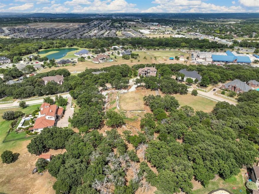 Feds cutting rates! Time to line up your builder and inspection team for soil compaction! Seller allows a 45 day inspection.  1.5 acre lot located among million dollar homes in Willow Creek Ranch. Spectacular elevation-views of Burleson and the Fort Worth Skyline! Bring your own drone! Walking distance to award winning N Joshua elementary school Driveway on upper main area is designed for 28' fire code. Always a breeze,even in August, on this property per seller. Outstanding secluded wooded lot with full Burleson utilities and Johnson county taxes. Willow Creek is a great community with sidewalks for walking or running, beautiful homes and in a great location close to everything! Unique lot gives separation from neighbors and Lot favors Sater Design Courtyard lot floor plan numbers 6787 or 6913 or Don Gardner Astoria Plan(all two story) or a walkout basement plan (mountain style) Don't miss this great property!! Make sure your property reflects the wealth of your house!