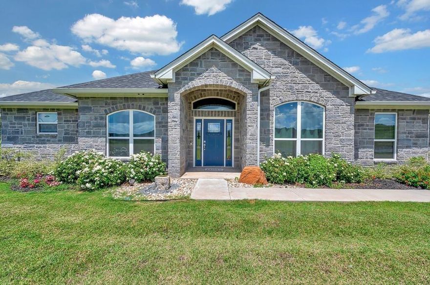 NEW IMPROVED PRICE on this breathtaking 2022 custom-built home located in the exclusive equestrian section of White Bluff Resort at Lake Whitney. Set on a sprawling and RARE 2-acre lot, this property seamlessly combines elegance with practicality, offering an extraordinary living experience.. With 2,941 sq. ft. of thoughtfully designed living space, this home boasts an open-concept layout featuring a spacious living room, family room, and gourmet kitchen, complemented by a formal dining room and cozy breakfast nook. The  primary suite includes a spa-like bathroom, a generously sized walk-in closet with custom built-ins, and ample natural light. Additional highlights include a versatile exercise room or office, a theater or game room for entertainment, and a large 3-car garage. White Bluff Resort is a premier, gated community that offers an unmatched lifestyle along the scenic shores of Lake Whitney. Spanning over 3,450 acres of rolling hills and wooded landscapes, this resort provides a blend of natural beauty, recreational amenities, and modern conveniences. Whether you're an avid golfer, water enthusiast, or simply seeking tranquility, White Bluff Resort has something for everyone. Experience the perfect balance of adventure, relaxation, and luxury in one breathtaking location. Enjoy the serenity and privacy of this remarkable property, perfectly situated within the prestigious White Bluff community.