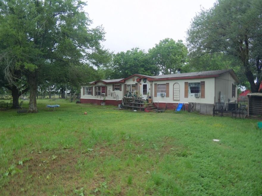 Situated on 8.8 acres in rural Hunt County, this property offers a unique opportunity for investors or buyers looking to create value through renovation. The 2,126 SF doublewide home is in poor condition and will require significant repairs, but the groundwork is in place for a rewarding project. Multiple barns and storage buildings provide added utility for agricultural, workshop, or equipment use. The land is fenced and cross-fenced, making it well-suited for livestock or rural living. Priced below assessed value and offered strictly as-is, this property presents strong upside potential for those ready to put in the work. 7.8 acres of the propert are Ag exempt, making the tax burden low. Located only 6 miles from the public Caddo Creek boat ramp on West Tawakoni Lake. 

Hunt County continues to see steady growth with a population exceeding 120,000 residents , while nearby Greenville, the county seat, has grown to over 37,000 residents with a median household income around $62,000 . Quinlan offers a smaller-town setting with a population of approximately 1,600 and a median household income near $44,500 . This combination of rural space and proximity to growing communities makes this property a compelling investment in a developing market.

Buyer and buyers agent to verify all measurements.