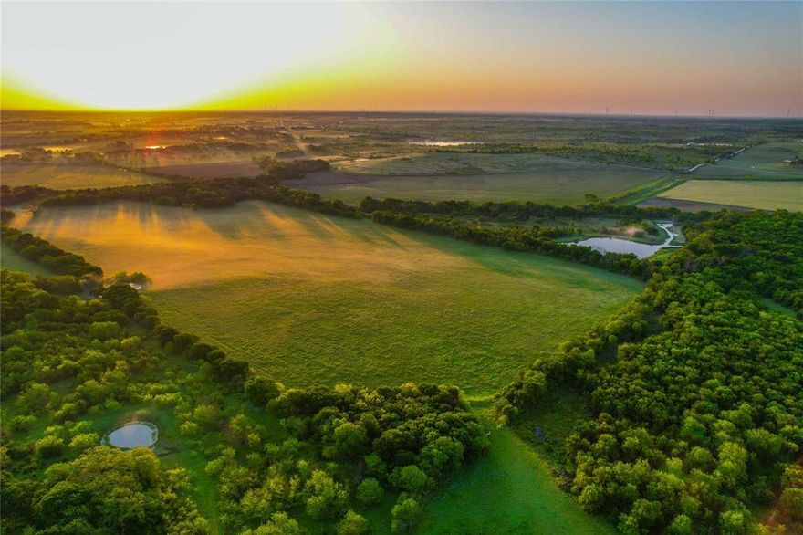 Welcome to your dream property in the heart of Central Texas! This 69-acre gem offers the perfect blend of comfortable living, natural beauty, and agricultural potential. Nestled among mature hardwoods and rolling pastures, the property includes a charming 3-bedroom, 2-bath brick home with a covered front porch—ideal for enjoying peaceful country mornings—and an attached carport for convenient covered parking. The land is thoughtfully laid out for a variety of uses. It features perimeter fencing and cross fencing, making it ready for livestock or continued hay production. Two scenic ponds and a gently flowing creek enhance the landscape, offering both beauty and functionality for livestock and wildlife. Whether you're looking to raise animals, hunt deer, grow hay, or simply enjoy recreational land, this property is well-equipped to meet your needs. The property has white-tailed deer, hogs and other wildlife. Utilities are already in place, with a water meter, electric meter, and septic system serving the home. The residence offers a warm, inviting interior with plenty of space for a family or guests, while the land offers room to roam, explore, and expand. Located in a desirable area of Central Texas, this property combines the serenity of rural living with accessibility to nearby towns and amenities. With its mix of open pastures, mature trees, and water features, it's perfect for anyone looking to enjoy country life, enjoy a weekend retreat, start a farm, or invest in versatile acreage. Don't miss this rare opportunity to own a turnkey homestead with income-producing potential and scenic charm. Schedule your private showing today!

- 1676 +- sf 3 bed 2 bath brick home built in 2000

- Property fully fenced with cross fencing

- Water meter, electric and septic in place

- 2 ponds and a clear running creek

- 1 storage shed and 2 loafing barns