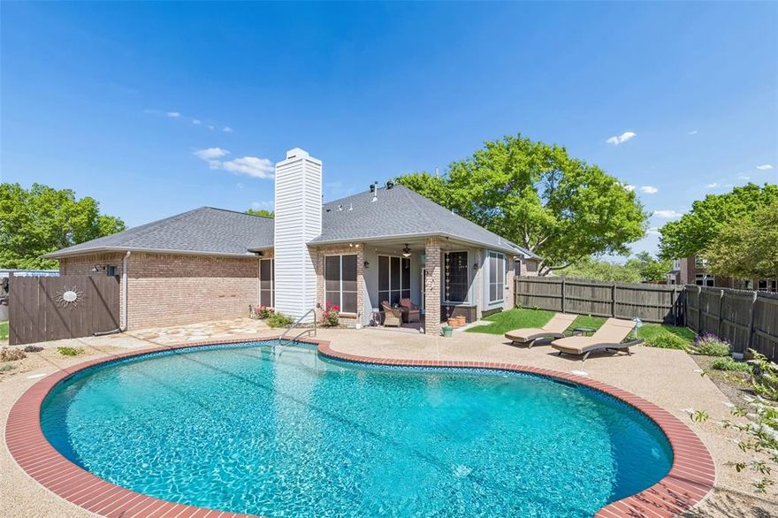 Gorgeous one-story brick ranch-style home set along a beautiful tree-lined street in the distinctive Brooks community, where pride of ownership shines and there is no HOA. This inviting residence blends comfort, style, and functionality, all enhanced by abundant natural light throughout. The heart of the home is the beautifully updated kitchen, featuring an island cooktop, wraparound bar seating, and generous workspace—perfect for both everyday living and entertaining. The open-concept family room is framed by a wall of windows overlooking the backyard, filling the space with light while offering a serene view of the sparkling pool. A floor-to-ceiling brick fireplace serves as a striking focal point, adding warmth and character. The thoughtfully designed split-bedroom layout offers added privacy, with the primary suite situated in its own wing. The en-suite bath has been tastefully updated with modern finishes, creating a relaxing retreat. Secondary bedrooms are well-sized and versatile. Enjoy the backyard oasis, where the pool and well-maintained patio provide an ideal setting for gatherings or quiet relaxation. Additional highlights include a three-car garage with durable epoxy flooring, an extended driveway for additional parking, and a convenient ante-room with plumbing for a sink, offering flexibility for a variety of uses. Located in a peaceful, established neighborhood with convenient access to shopping, dining, and major routes, this home offers both tranquility and accessibility in a truly special setting. 3D tour available online.