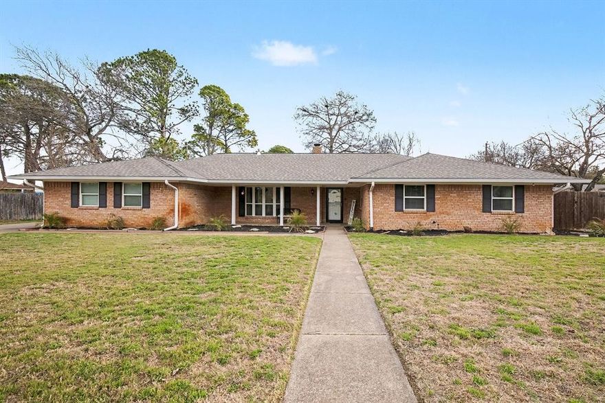 Nestled on a quiet cul-de-sac in the heart of Pantego, this inviting home sits on a rare .29-acre tree-lined lot offering space, privacy, and flexibility that’s hard to find. Inside, enjoy a versatile layout with multiple living areas, including a cozy living room with fireplace, ideal for entertaining or everyday comfort. The kitchen features granite countertops, stainless steel appliances, and tile flooring, flowing seamlessly into the main living spaces. The spacious primary suite includes an updated ensuite bath with a walk-in shower, extended counter space, and a stylish barn door. Step outside to a generously sized backyard with a covered concrete patio, perfect for gatherings, play, or quiet evenings, while the long driveway provides abundant parking with room for a boat or RV, and the two-car garage offers additional storage or workshop potential. Cul-de-sac location, oversized lot, and central Pantego convenience come together to deliver comfort, character, and opportunity in one of the area’s most desirable settings.