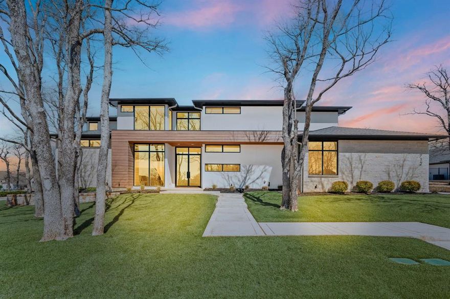 Exquisite Willowtree Custom Home was completed in 2023 and is move-in ready. Stunning and thoughtfully designed transitional modern in privately gated Legacy North on almost a half acre treed lot offers 5 bedrooms, 5 full and 1 half baths, 4 car garage, ensuite bathrooms, 2 utility rooms, downstairs media, office, game room, solid-core doors throughout, luxury engineered white oak flooring, remote controlled window treatments, museum finish walls. Open floor plan welcomes you into a chef’s kitchen complete with Wolf appliance package, built-in refrigerator, seamless white and wood cabinetry, oversized Taj Mahal quartzite island and counters, double convection ovens, drawer microwave, 6 burner range with griddle. Living room features linear fireplace and sliding doors overlooking expansive backyard. Primary bedroom with his-and-hers closets, double shower, soaker tub. Private guest suite down offers huge walk-in shower. Second living down is utilized as a media and offers wet bar, wine fridge, black-out window treatments and sliding door to patio. Upstairs offers 3 bedrooms, game, utility, walk-out attic with huge floored storage, spray foam encapsulated for energy efficiency. The outdoor living area is perfect for entertaining and offers a covered patio area, built-in grill, stone fireplace, infrared heaters, zoysia grass. The electronic privacy screens on the patio offer the perfect blend of indoor-outdoor living, creating an inviting space for hosting gatherings. Plenty of room for pool, pets and play. Four garages with epoxy floors and space for extended parking on driveway. Seller is prepared to offer a reasonable pool allowance if a buyer would prefer a pool. Seller will also pay a year's worth of HOA dues at closing. Gorgeous!