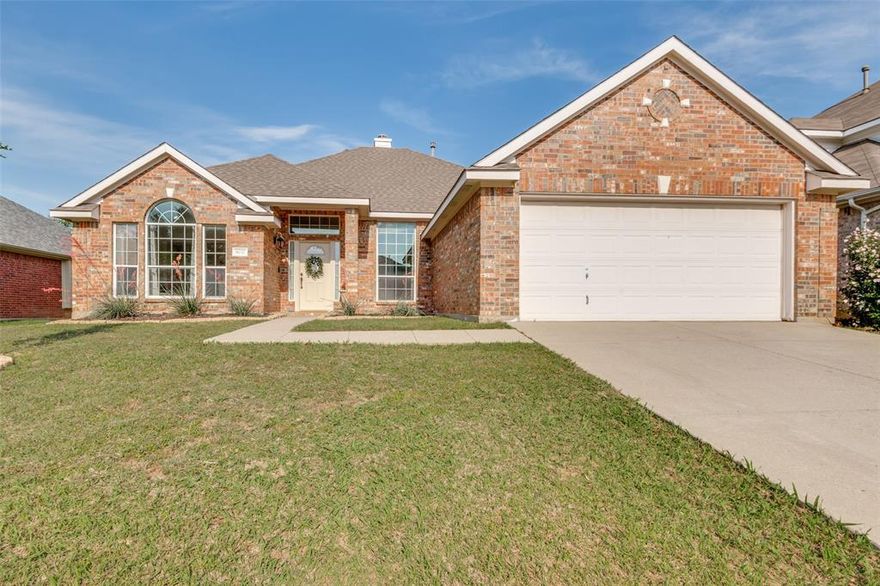 Welcome home to this beautifully maintained 4-bedroom, 2-bathroom home in desirable North Fort Worth! Ideally located near schools, shopping, restaurants, and everyday conveniences, this home offers the perfect blend of comfort, style, and functionality. Step inside to discover light-tone wide plank laminate flooring that flows throughout the main living spaces, creating a bright and inviting atmosphere. The open-concept layout is ideal for both entertaining and daily living.

The spacious kitchen is designed with the home chef in mind and features a large island with seating space, a gas range, ample cabinetry, and plenty of prep space for cooking and gathering with family and friends. The adjoining living and dining areas provide an easy flow and plenty of natural light.

Retreat to the private primary suite featuring dual sinks, a relaxing soaking tub, separate shower, and generous walk-in closet. Three additional bedrooms offer flexibility for guests, a home office, or hobbies.

Step outside to the backyard patio, the perfect spot for morning coffee, evening beverages, or weekend grilling. The neighborhood offers fantastic amenities including walking trails, bike paths, and a playground, giving you plenty of opportunities to enjoy the outdoors and connect with the community.

This North Fort Worth gem combines location, thoughtful features, and neighborhood amenities into one wonderful place to call home!
