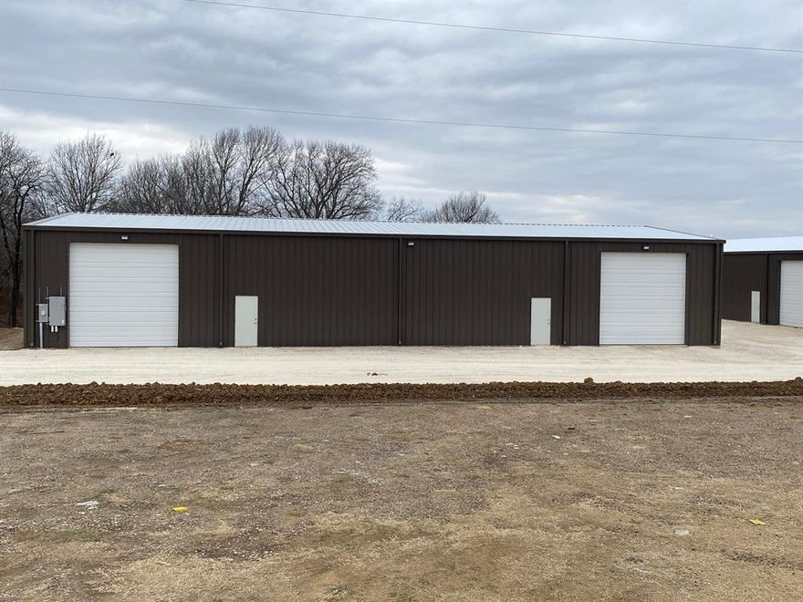 5,000  sq ft insulated open span building with two 14' wide rollup doors and 2 walk through doors.   2 restrooms.  It is currently divided into two units of 2,500 sq. ft each.  Both units are leased.   A great income producing property.  

Note: individule tax ID has not been assigned yet.