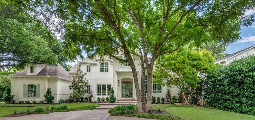 Beautifully remodeled home by Mills Custom Homes blends exquisite finishes with thoughtful design, offering a perfect balance of luxury and functionality for both everyday living and entertaining. The chef’s kitchen is the heart of the home flanked by the breakfast room and new wet bar and temperature-controlled wine room that open into the formal living room. It flows seamlessly for entertaining. The breakfast room is open to the great room, where soaring windows flood the space with natural light and showcase views of the lushly landscaped backyard and pool. The backyard is an entertainer’s dream with plenty of yard space, featuring a pool bath, pavilion with a grill, refrigerator, and seating area. The first floor includes the primary suite with pool views, a guest suite with a kitchen and living area, another ensuite bedroom, and a versatile exercise room or flex space. Upstairs offers three additional bedrooms, a playroom and a spacious craft room or office with ample storage. The indoor recreational area is a conditioned space featuring a beverage unit, built-in cabinetry, golf simulator, and basketball goal, with the potential for additional recreational activities. Updates throughout the home include new wallpaper, plumbing fixtures, hardware, light fixtures, countertops, tile, pool, appliances, flooring, security system, and more. Situated on over half an acre in the highly sought-after Old Preston Hollow neighborhood, this home provides an ideal blend of comfort, style, and space for both everyday relaxation and entertaining.